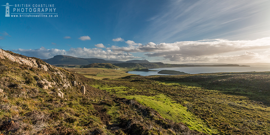 Duntulm Isle of Skye, grassy landscape, distant hills, distant sweeping bay