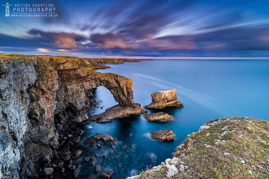 green bridge of wales sea arch with purple cloud movement skies